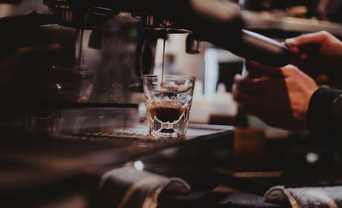 espresso dripping from machine